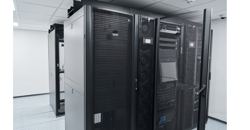 Shared colocation data center facility featuring secure server racks and network cabinets.
