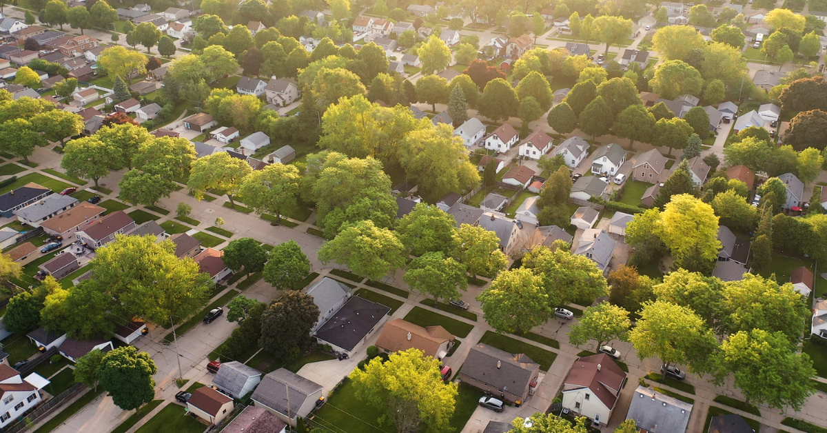 Aerial view of a residential neighborhood and subdivided housing development illustrating land market absorption rate and lot supply.