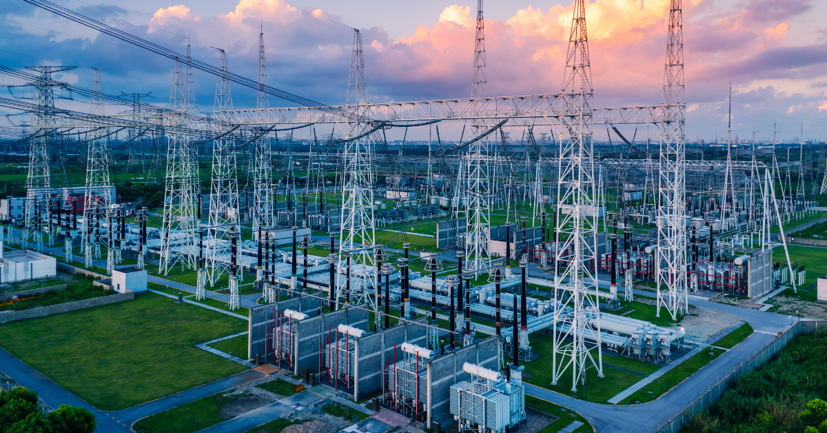High-voltage electrical substation and transmission tower infrastructure driving data center land valuation.