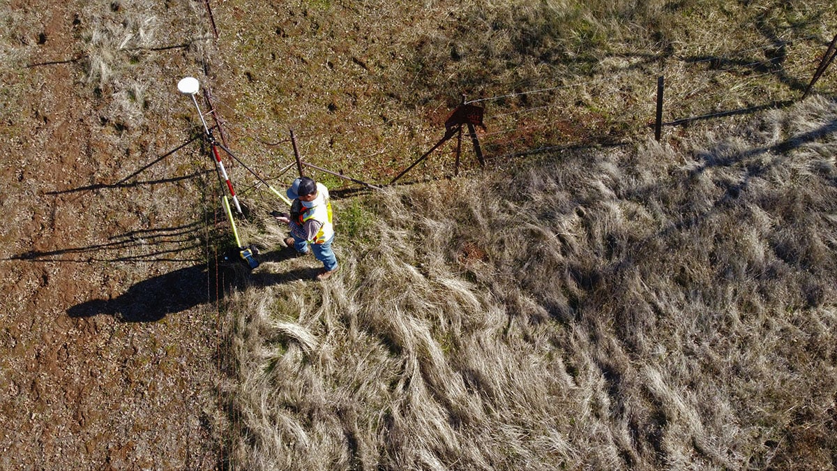 person surveying land